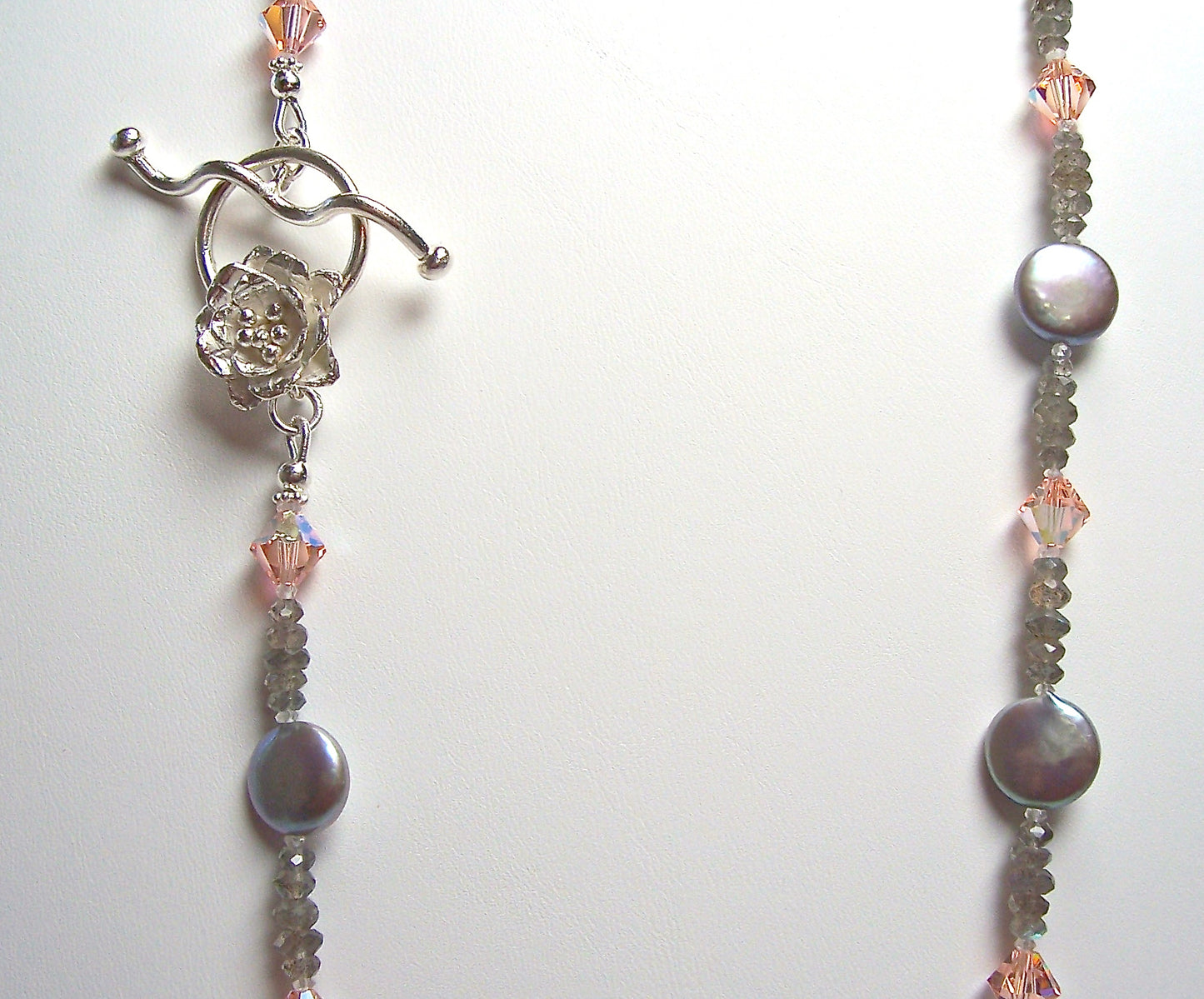 Closeup dove grey coin pearl necklace