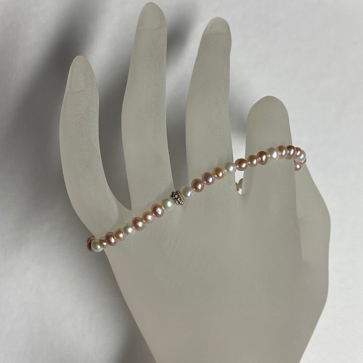 Arpaia 7.25" stretch bracelet with 4-4.5mm white and natural pink and purple cultured freshwater pearls