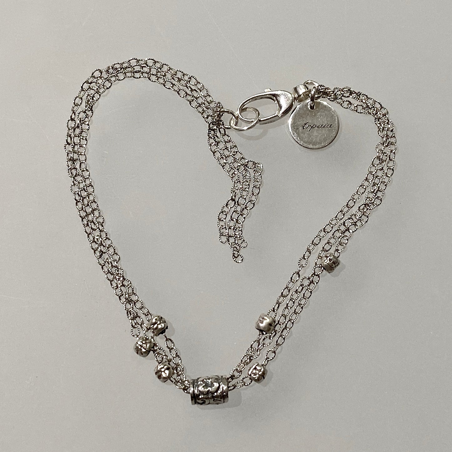 7.5" Antiqued Silver Flower Bead Bracelet with Tassel by Arpaia