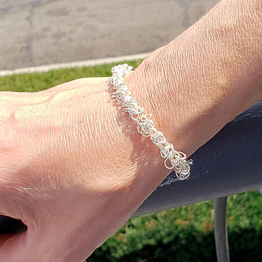 Arpaia Silver Frilly Bracelet on model - closeup outside natural light
