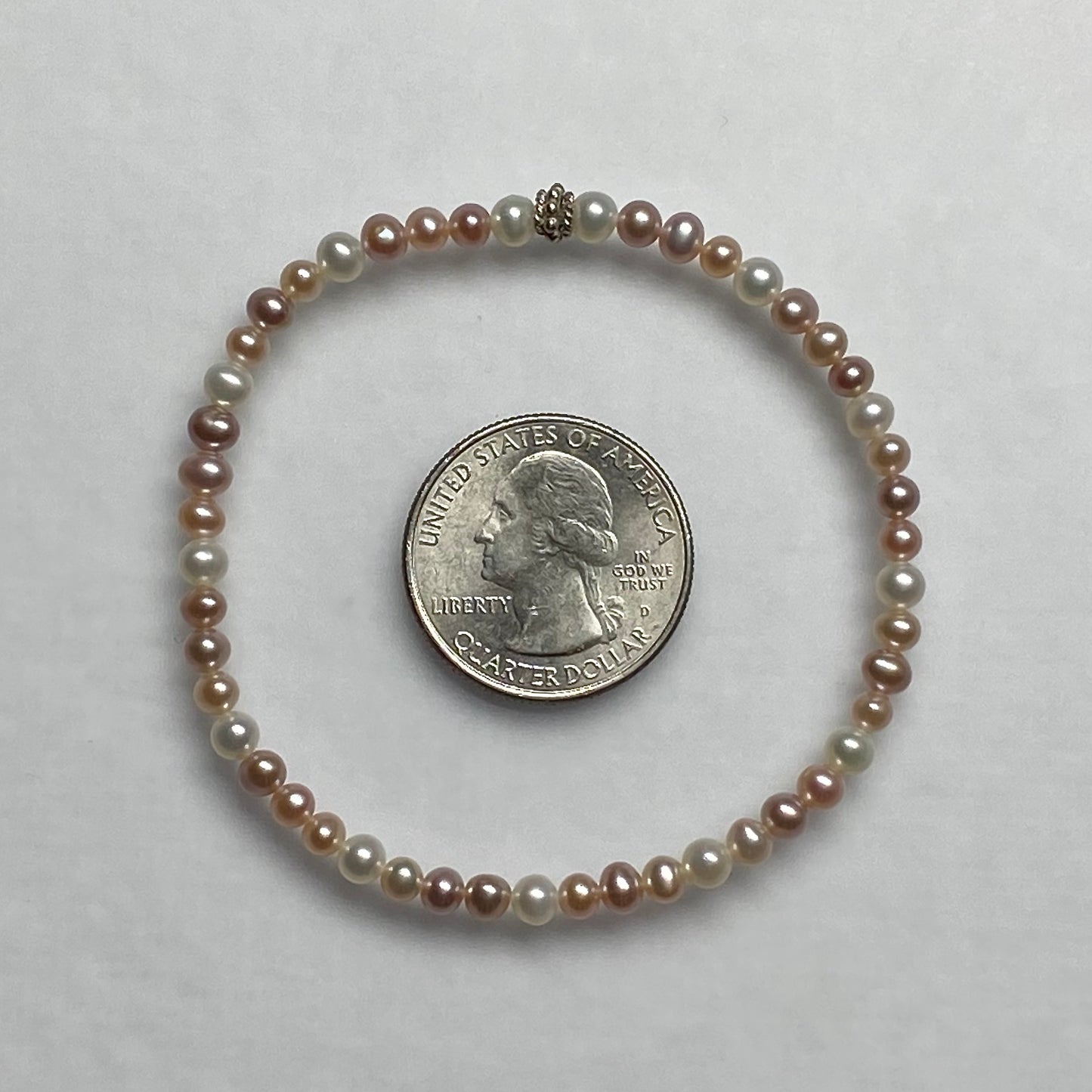 Arpaia 7.25" stretch bracelet with 4-4.5mm white and natural pink and purple cultured freshwater pearls