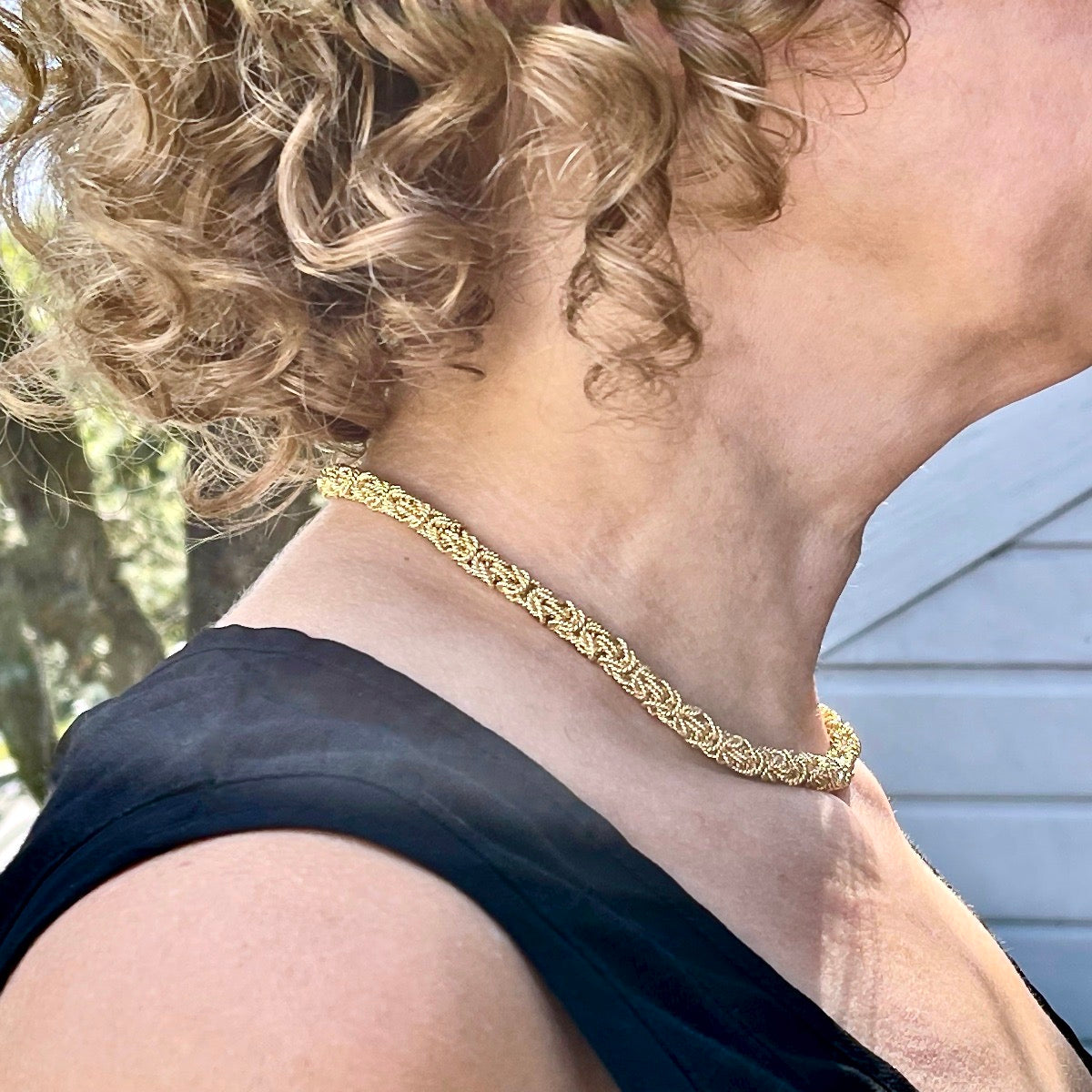 Side view of champagne vermeil byzantine choker on model