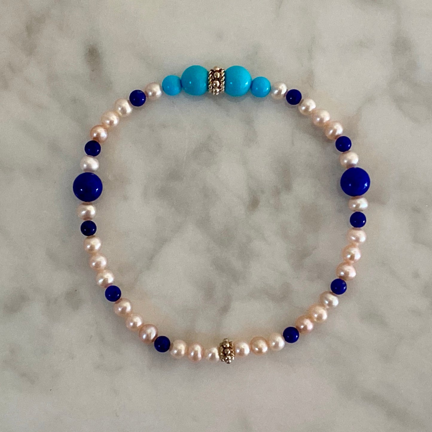 7" Stretch Bracelet with Natural Sleeping Beauty Turquoise and Lapis Lazuli Beads, Natural Pastel Color Cultured Freshwater Pearls, and Handmade Sterling Silver Bali-Style Beads