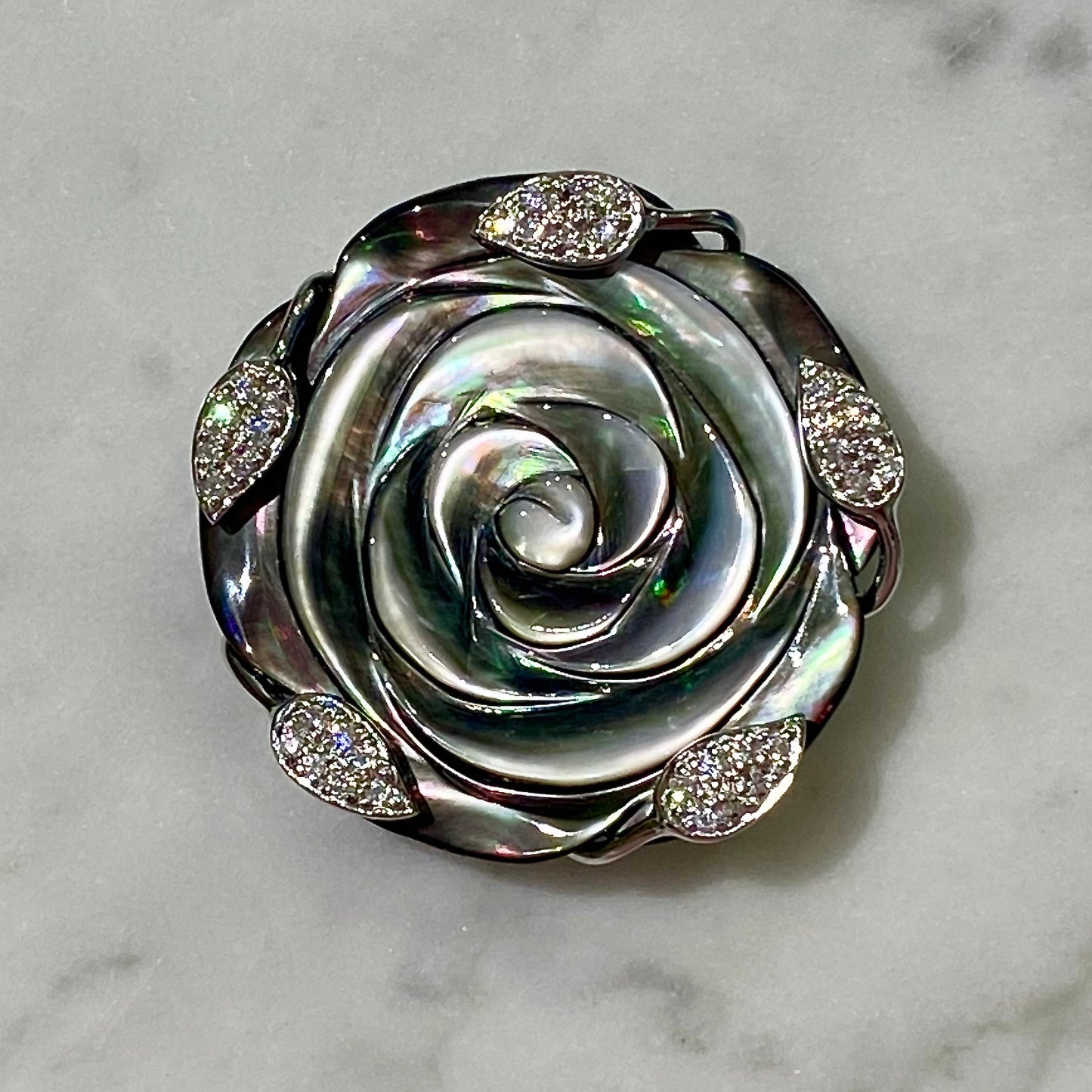 Natural Black Mother of Pearl Blooming Rose Pendant/Brooch with CZ-studded Leaves in Rhodium-Plated Sterling Silver (18" twisted black satin necklace cord included).