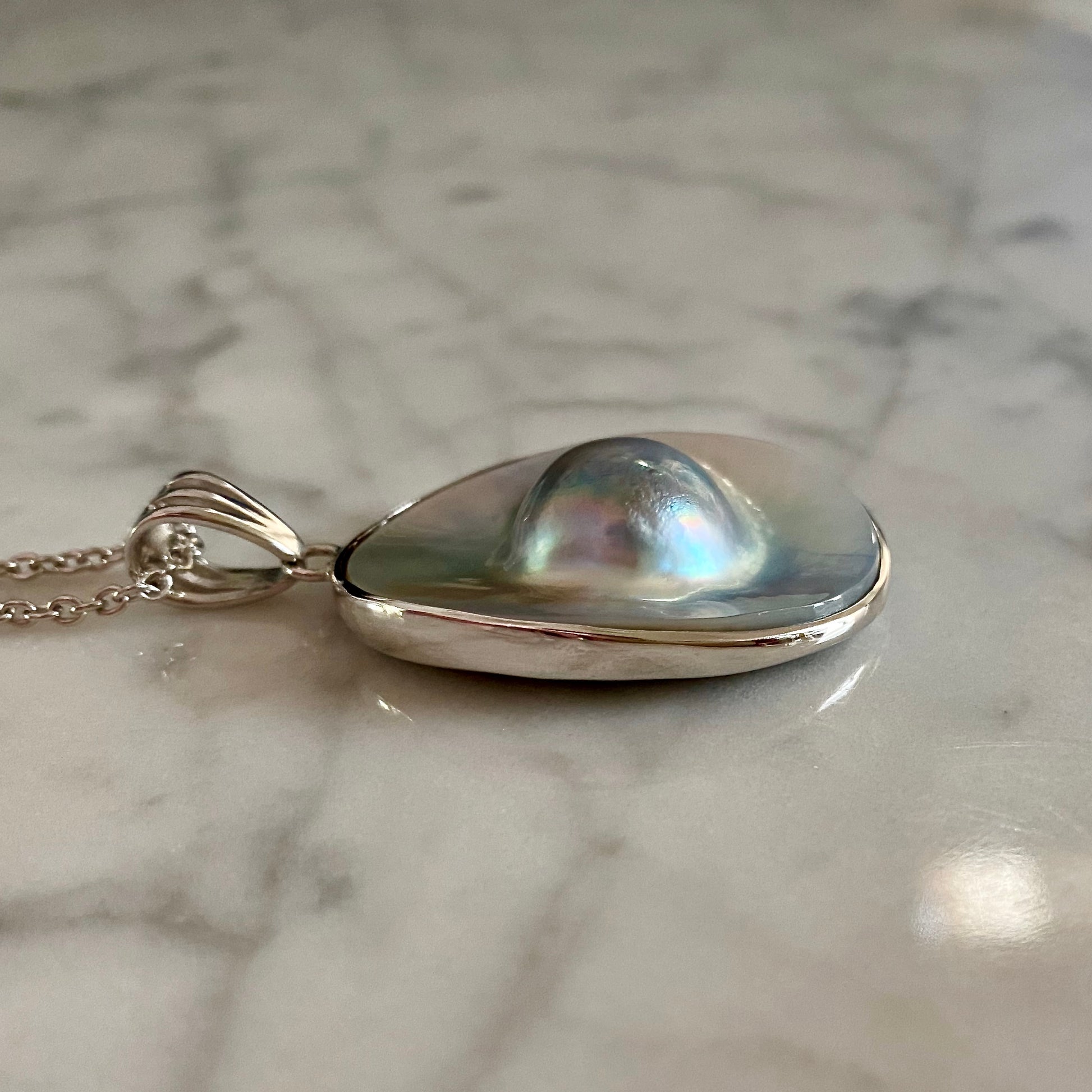 Side view Mabe blister pearl pendant / Arpaia Jewelry