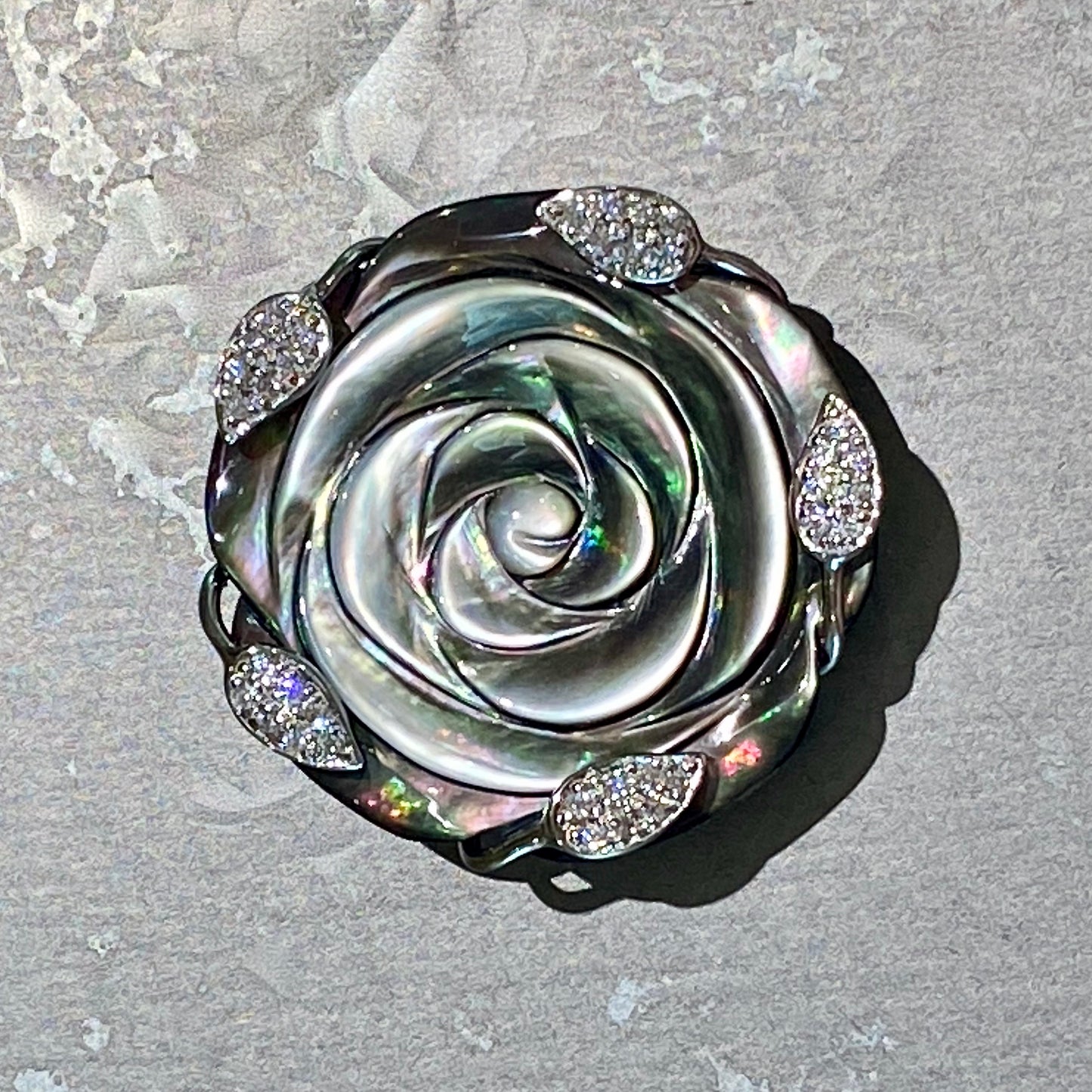 Natural Black Mother of Pearl Blooming Rose Pendant/Brooch with CZ-studded Leaves in Rhodium-Plated Sterling Silver (18" twisted black satin necklace cord included).