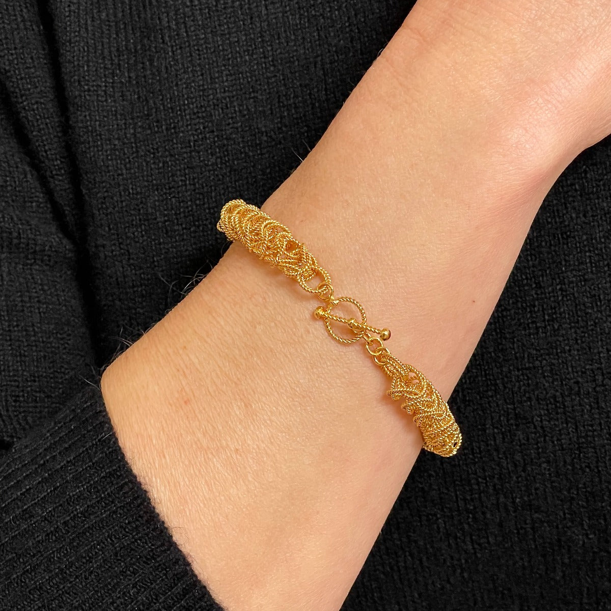 24K Gold 8mm Bellezza Bracelet clasp up on model / Arpaia Lang