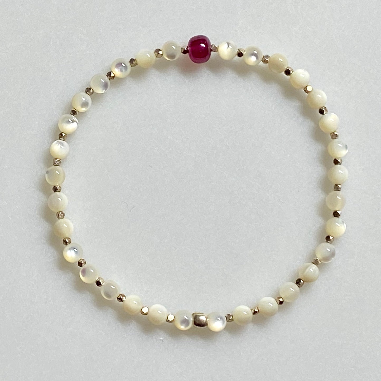 Arpaia gemstone stretch bracelet with natural ruby , mother or pearl, and 999 fine silver beads