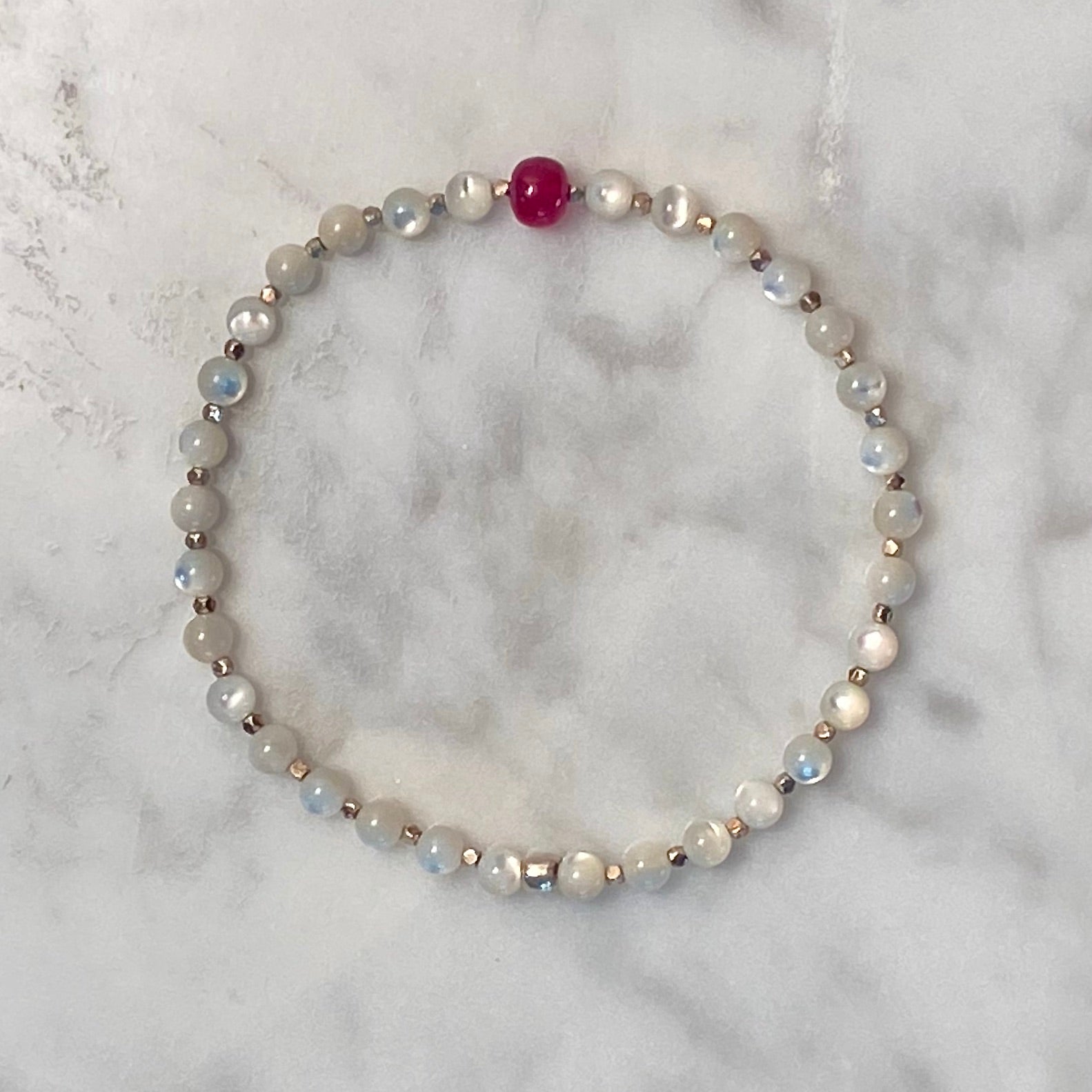 7-1/3" Arpaia gemstone stretch bracelet with natural ruby , mother or pearl, and 999 fine silver beads