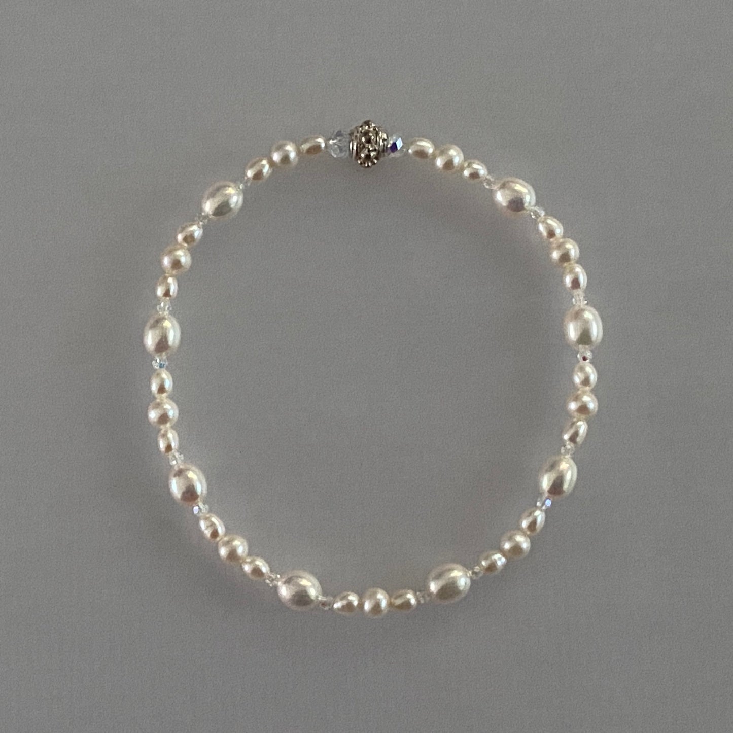 7-3/4" stretch bracelet with soft white freshwater cultured pearls and Swarovski crystal beads