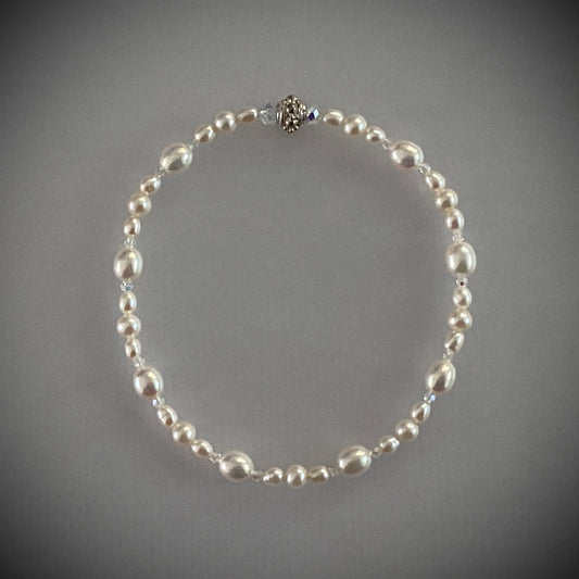 7-3/4" stretch bracelet with soft white freshwater cultured pearls and Swarovski crystal beads