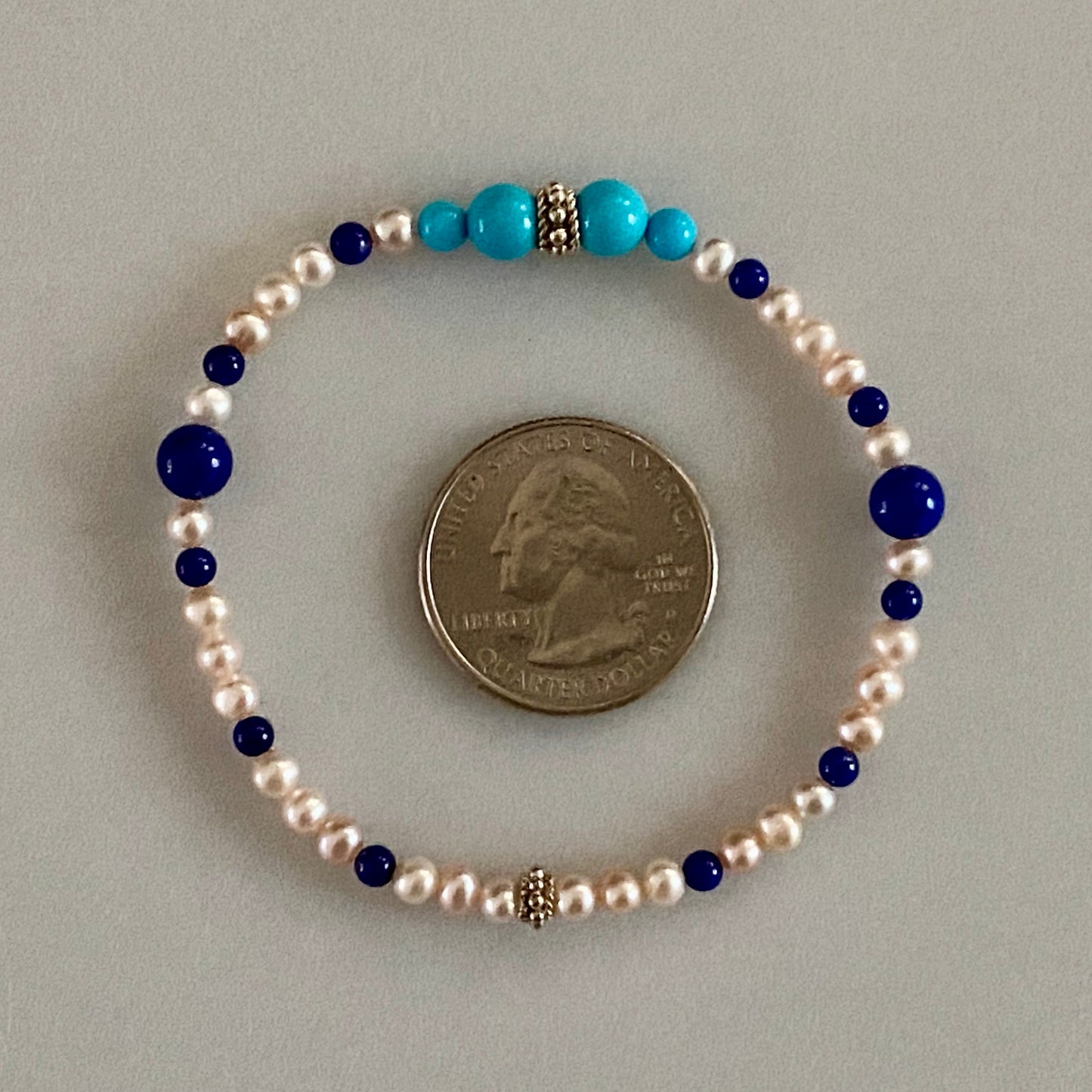 7" Stretch Bracelet with Natural Sleeping Beauty Turquoise and Lapis Lazuli Beads, Natural Pastel Color Cultured Freshwater Pearls, and Handmade Sterling Silver Bali-Style Beads