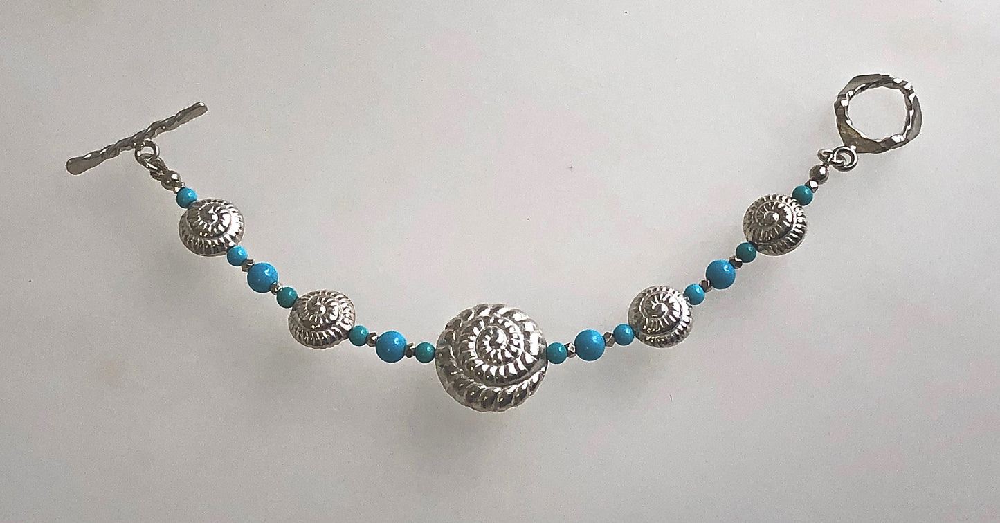 8" one of a kind Nautilus Shell Bracelet in artisan-crafted 999 Fine Silver with Sleeping Beauty Turquoise