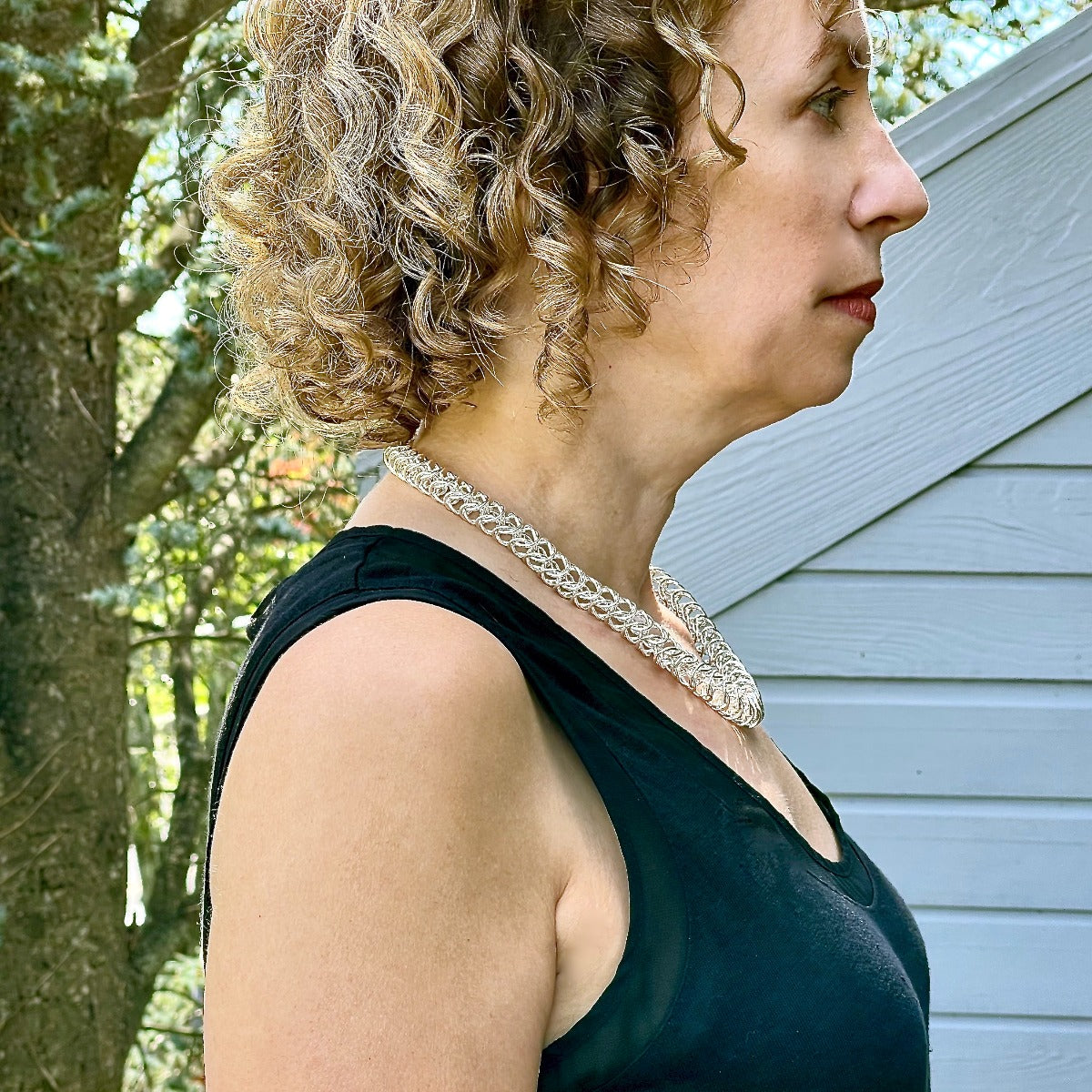 Sideview Arpaia Argentium Silver Necklace on model - outside natural light
