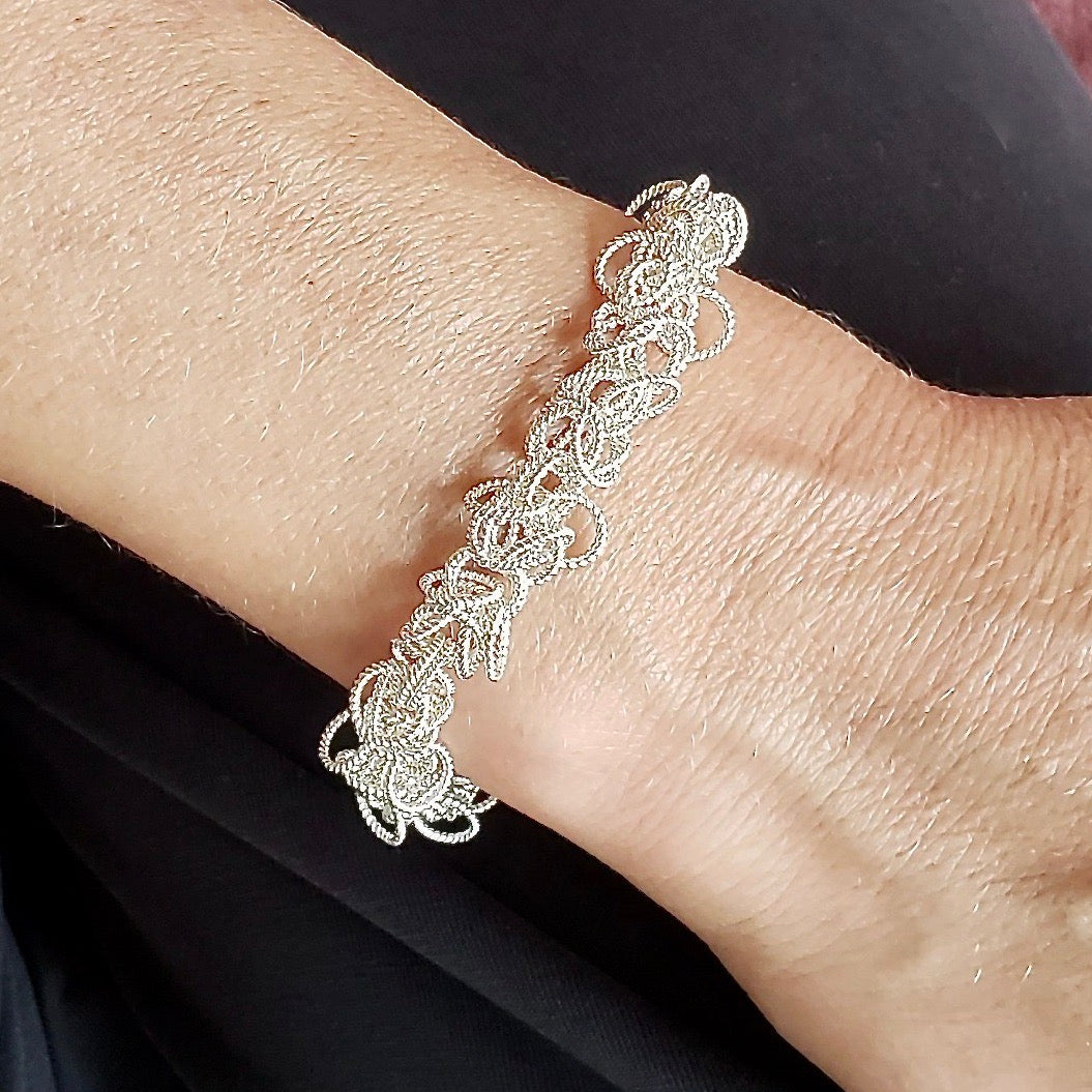 Arpaia Silver Frilly Bracelet on model - closeup inside natural light