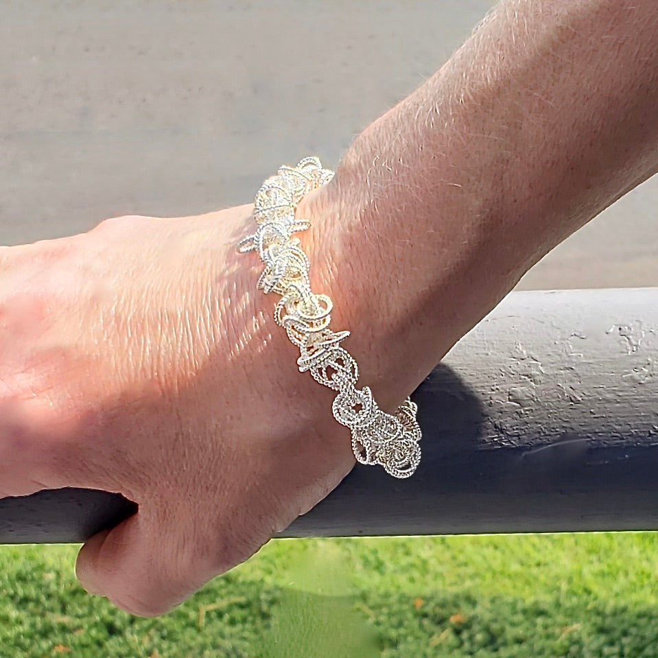 Arpaia Silver Frilly Bracelet on model - closeup outside natural light