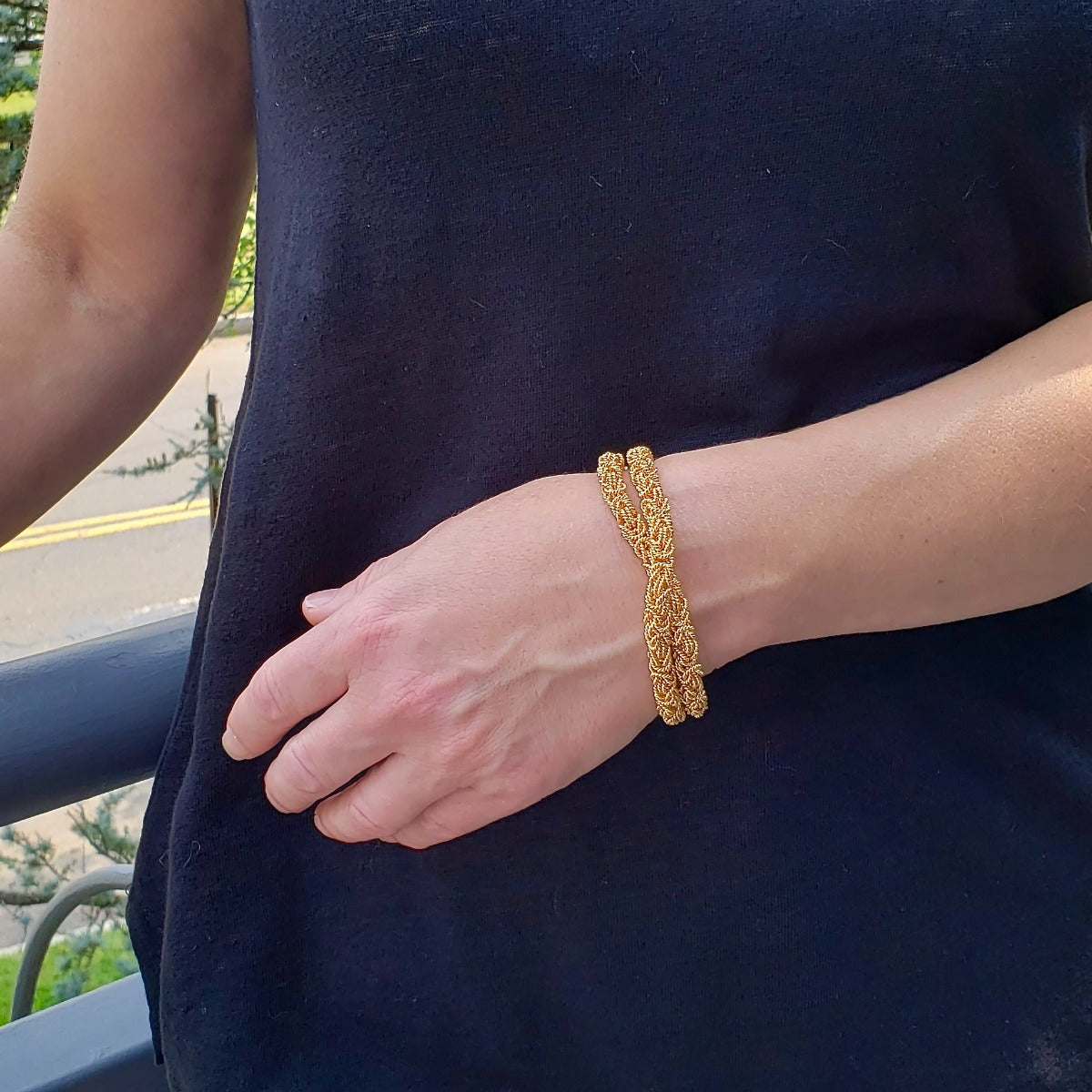 Arpaia Gold Vermeil Double Byzantine Bracelet on Model shown with bracelet in a single twist - outside natural light