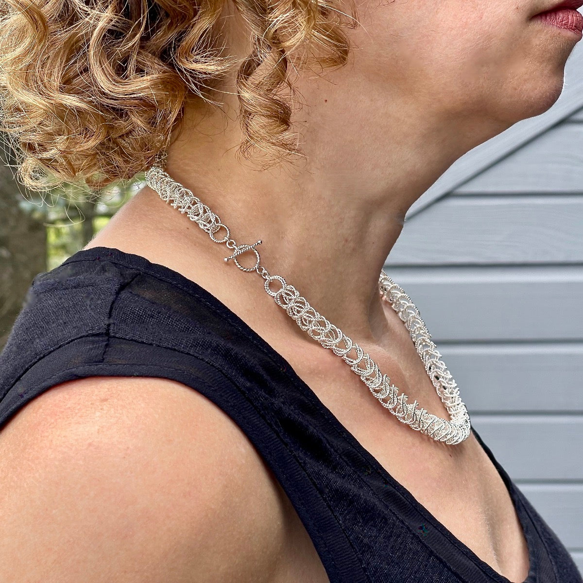 Side  view Classic Collection necklace on model with clasp worn on side / Arpaia Lang