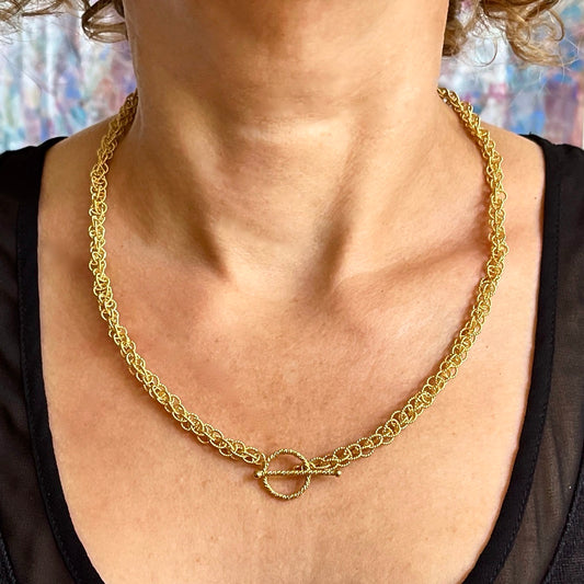 24K Vermeil 6mm Spinner necklace on model with clasp in front / Arpaia Lang